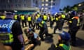 Police officers detain far-right protesters in Plymouth