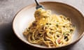 Fork twirling through bowl of garlic and chilli spaghetti.
