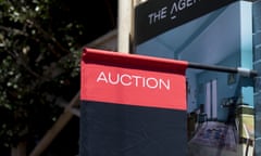 An auction sign hangs outside a residential property for sale in the Paddington suburb of Sydney