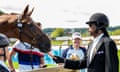 Snoop Doog wearing horse-riding gear and feeding a horse a carrot