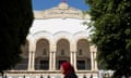 A woman walks near the Palace of Justice in Tunis, Tunisia May 13, 2024