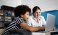 Teacher and student using a laptop in the classroom