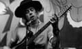 John Mayall with guitar wearing hat