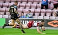 Jake Wardle scores a try for Wigan in their victory