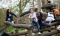 Children clamber up logs on the Highfields Adventure Playground in Leicester