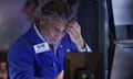 A trader works on the floor of the New York Stock Exchange after a global sell-off of shares sparked recession fears.