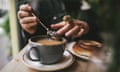 Man making tea in a cafe close up.