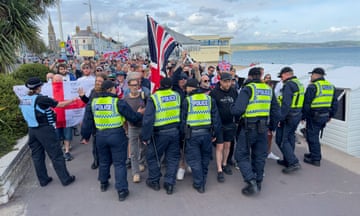 The police controlling far-right protesters in Weymouth on 4 August