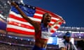 Gabby Thomas celebrates after winning the women's 200m