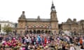 Members of the public form bubbles outside Southport's town hall during a vigil to remember the victims of the stabbing attack on 29 July